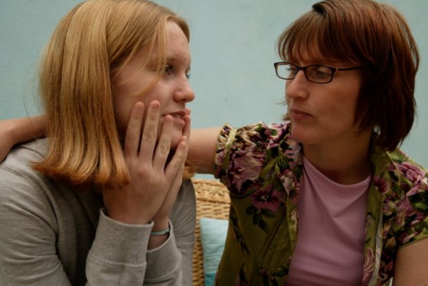 Picture of woman comforting a girl