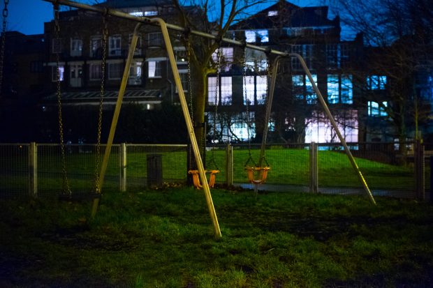 Picture of swings in a playground a night