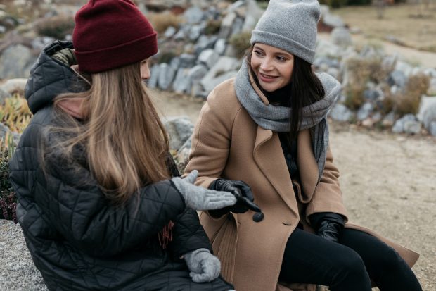 Two teenagers sat chatting