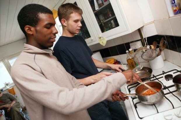 Two young people cooking together